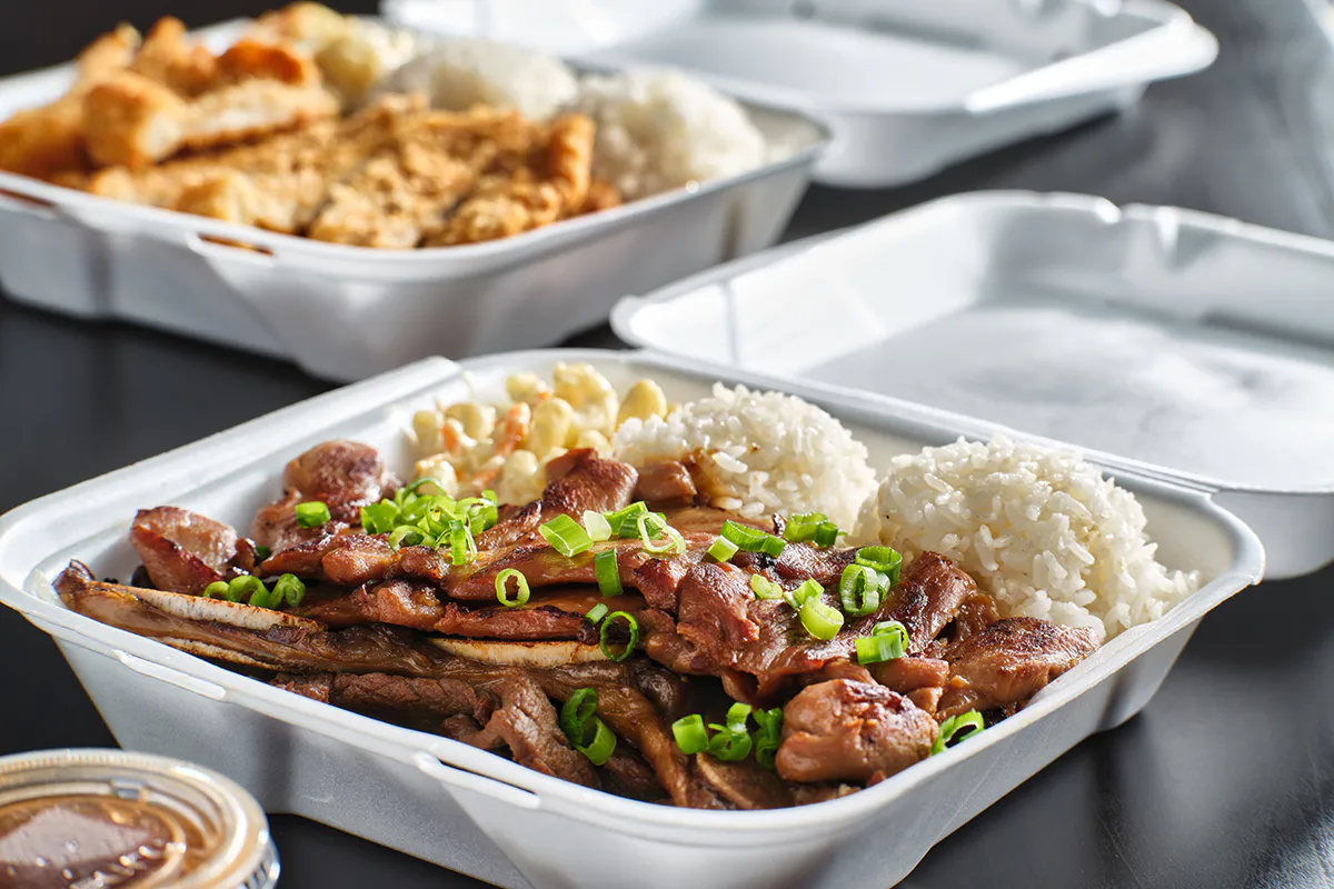 hawaiian bbq in take out container with mix of barbecue meats